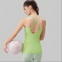Load image into Gallery viewer, Woman wearing a green sports bra with text highlighting features on a gray background